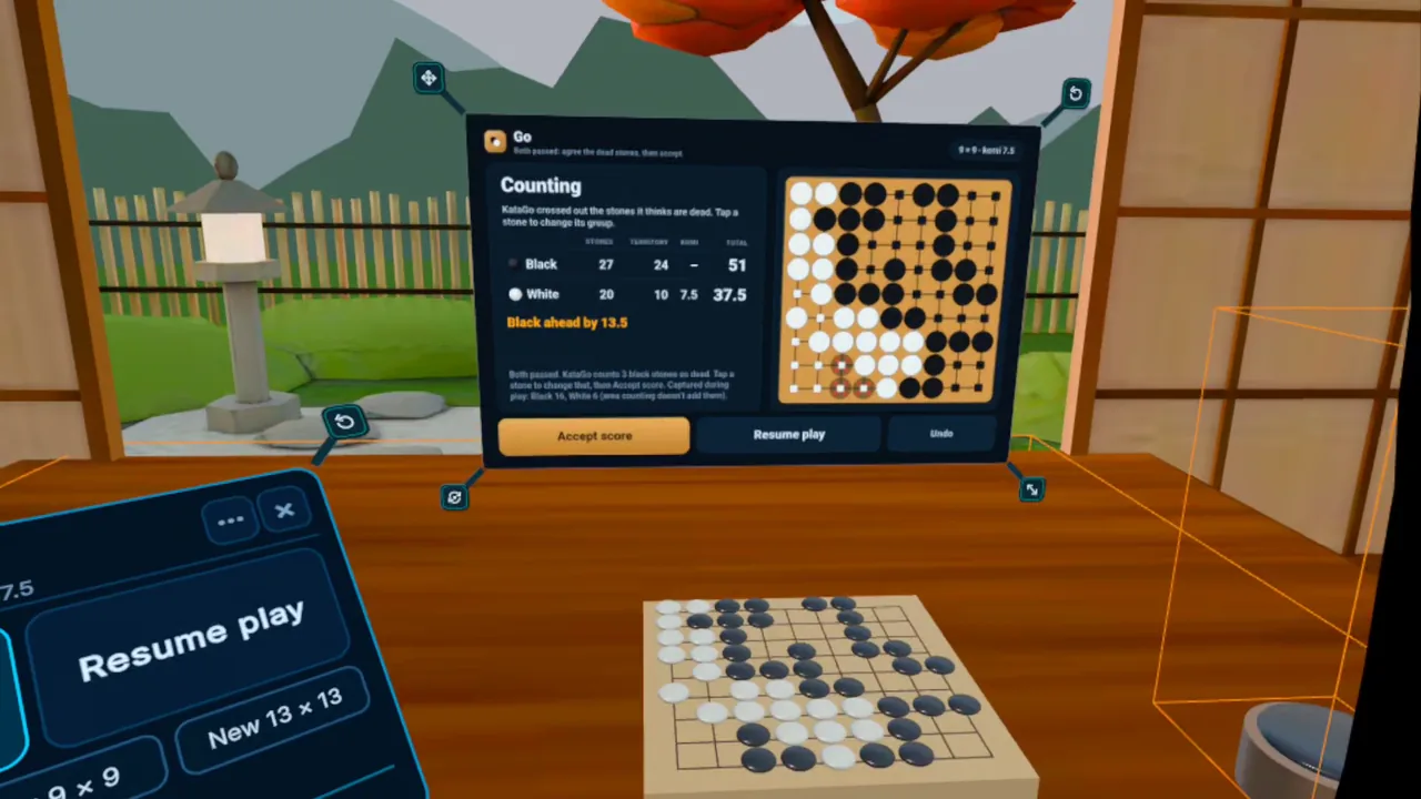 Headset view: the Go panel counting game 3, Black ahead by 13.5, above a 9 × 9 board on a desk in a tea room